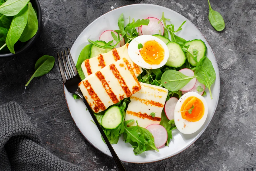 A plate with a salad and eggs, a healthy and appetizing meal option
